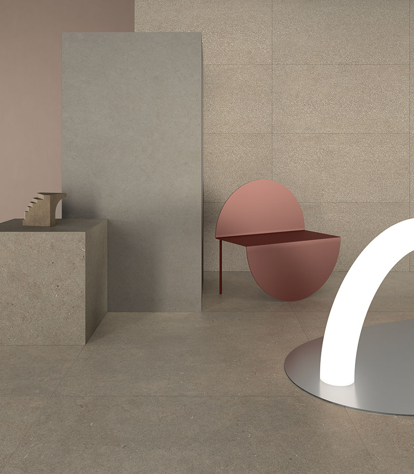 Intérieur minimaliste avec surfaces effet pierre, tons neutres et mobilier sculptural pour un espace contemporain et épuré.