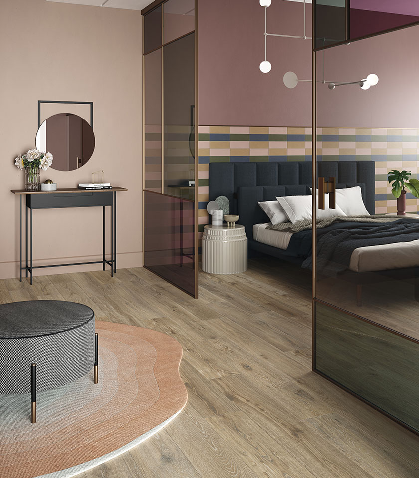 Bio Attitude Barrel apporte à la chambre la chaleur du bois céramique, associée aux tonalités délicates de Pigmenti pour créer une atmosphère accueillante et contemporaine.