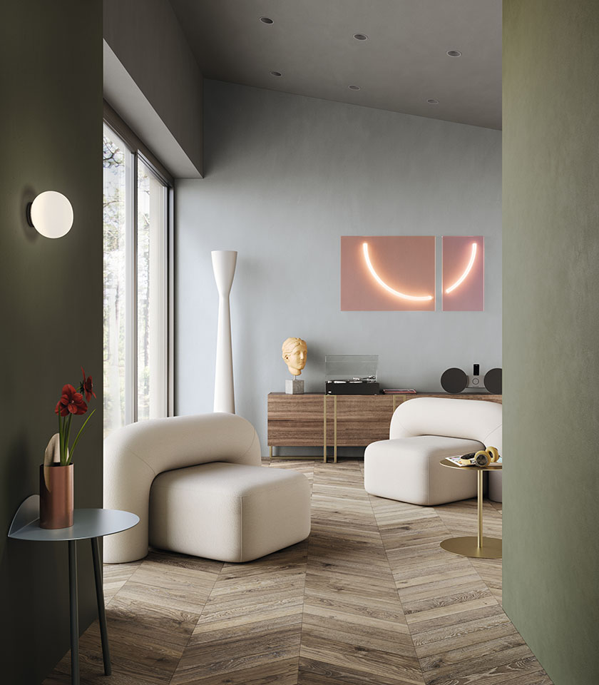 Découvrez des idées pour un salon moderne avec les surfaces effet bois Lea Ceramiche, entre chaleur naturelle, design contemporain et contrastes chromatiques raffinés.